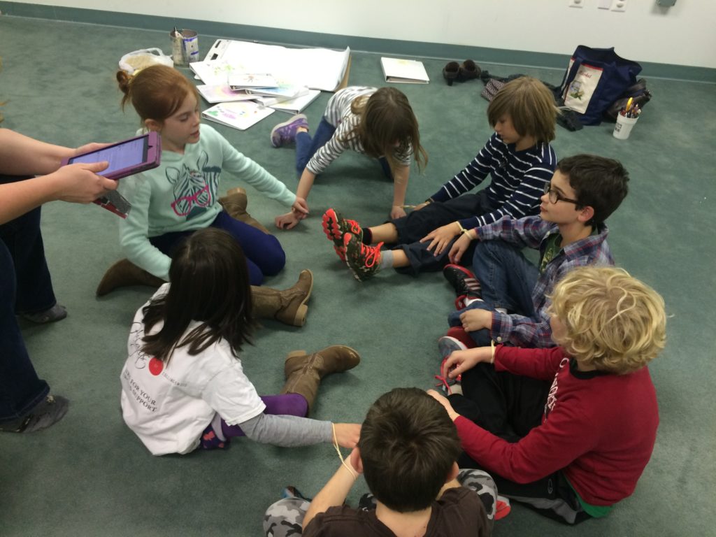 Kids sitting in a circle